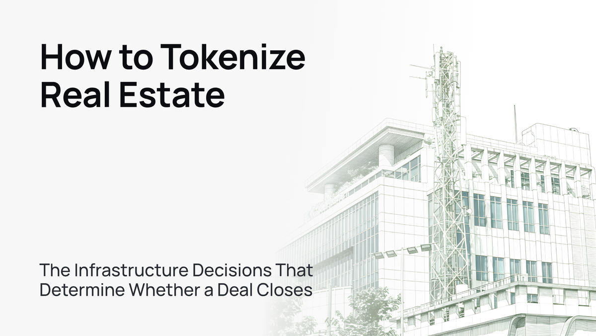 Modern glass office tower against a clear blue sky, symbolizing real estate tokenization infrastructure.