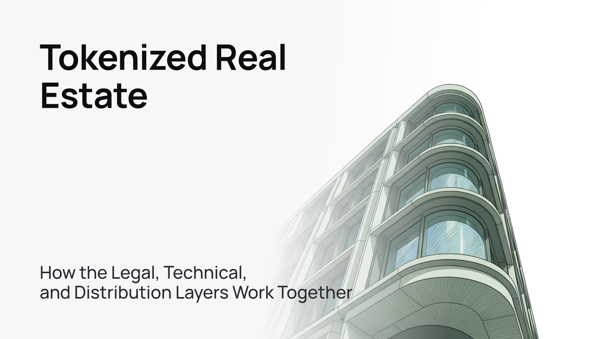A sleek, modern office building standing tall against a clear blue sky.