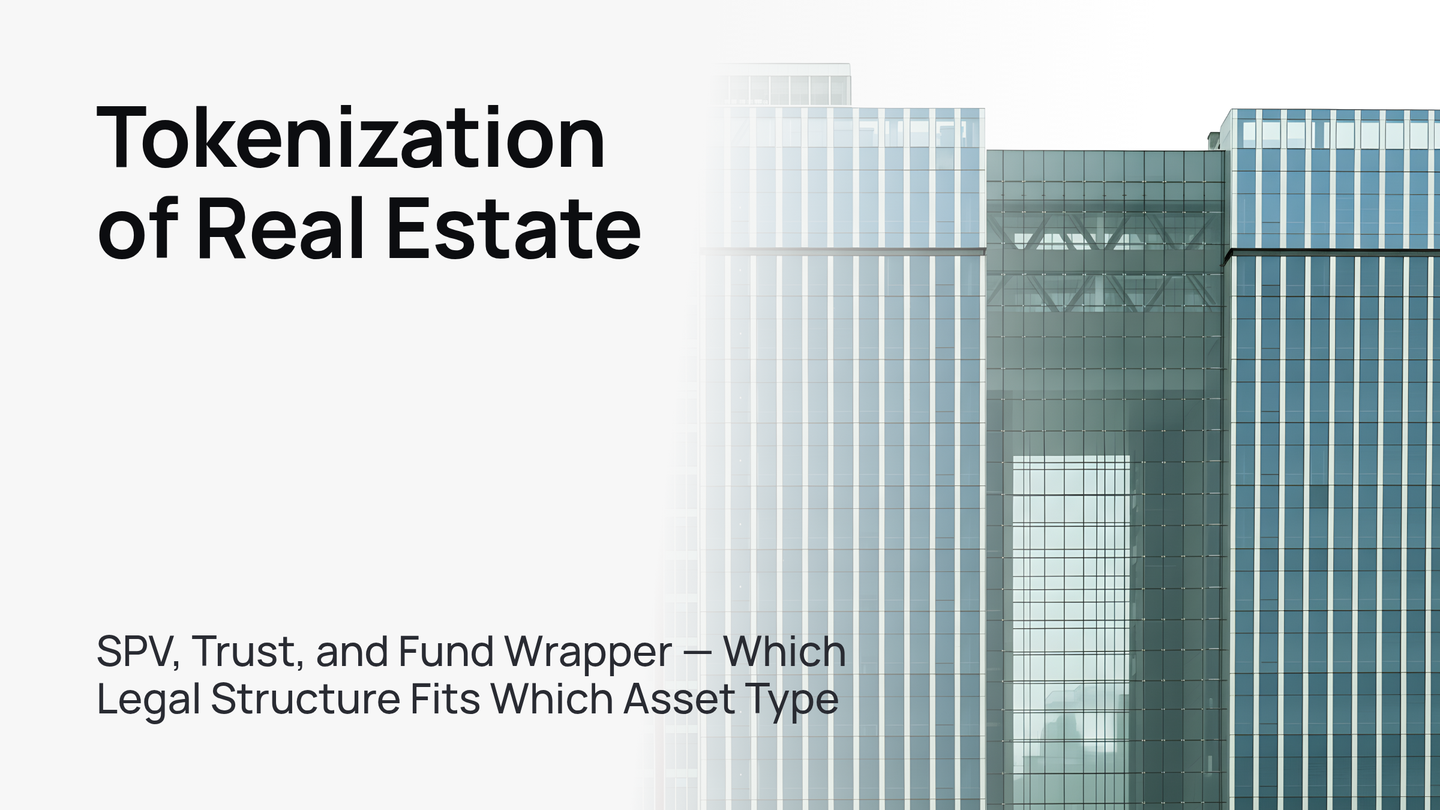 A modern glass skyscraper against a clear blue sky, symbolizing real estate tokenization.