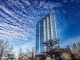 Modern skyscraper against blue sky