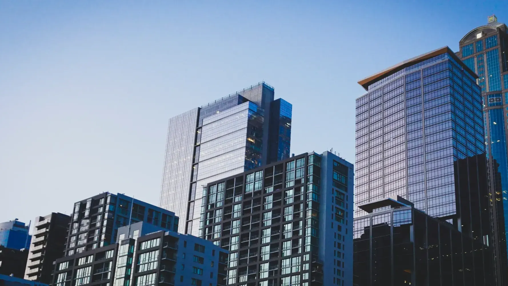 Generic modern skyscraper — representing the global shift toward digital real estate ownership.