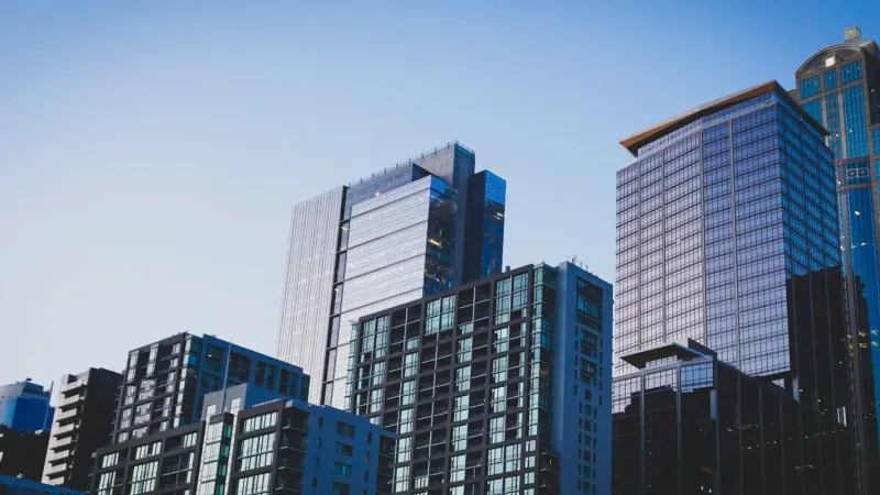 Generic modern skyscraper — representing the global shift toward digital real estate ownership.