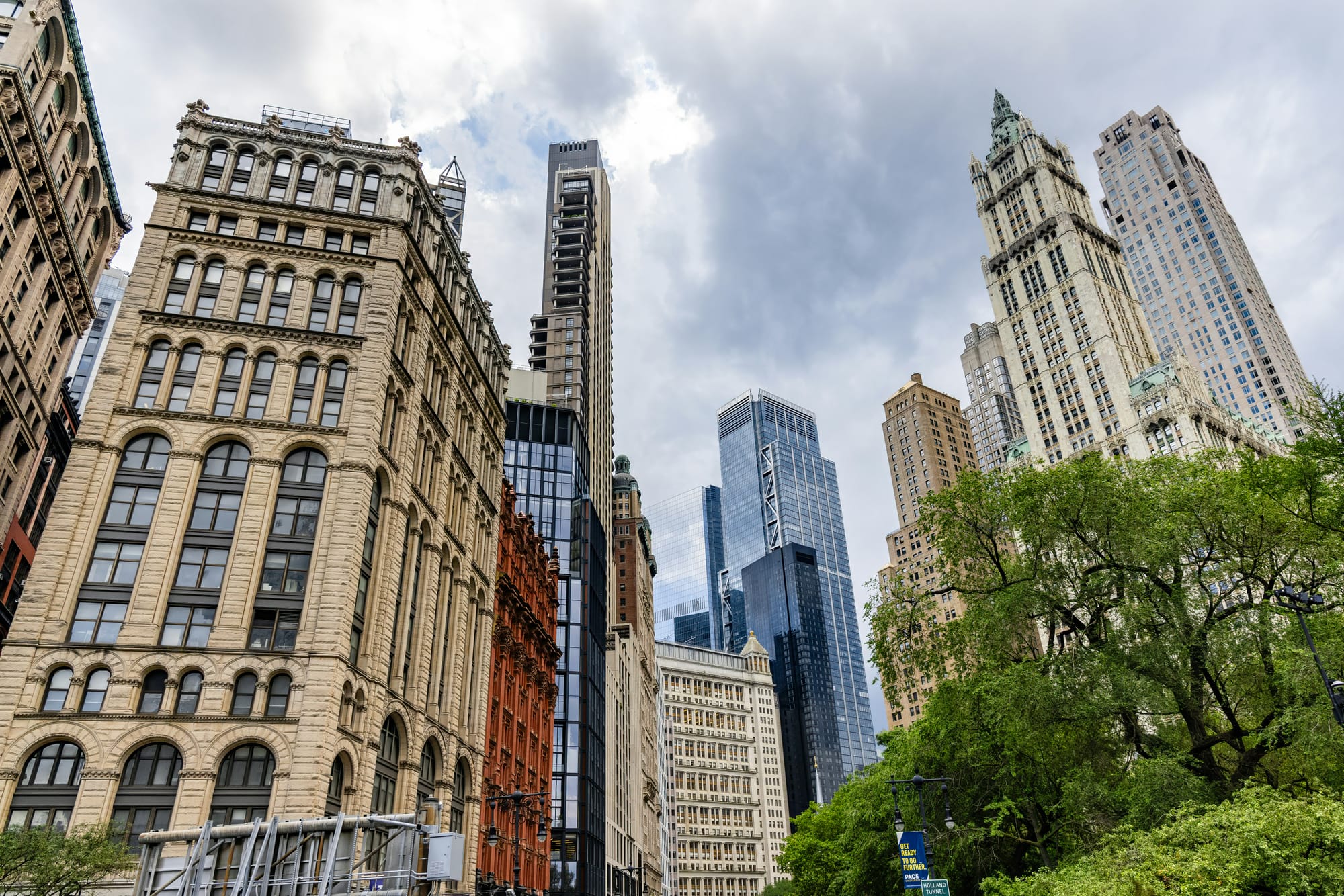 New York City skyline with historic and modern skyscrapers under cloudy sky
