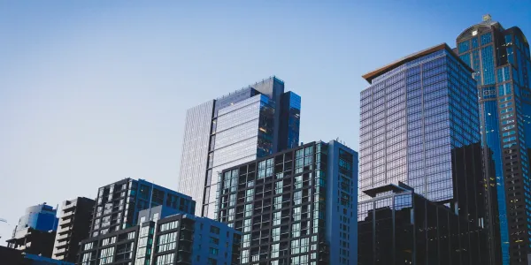 Generic modern skyscraper — representing the global shift toward digital real estate ownership.